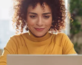Happy woman on laptop