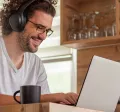 Man working at home and looking happy