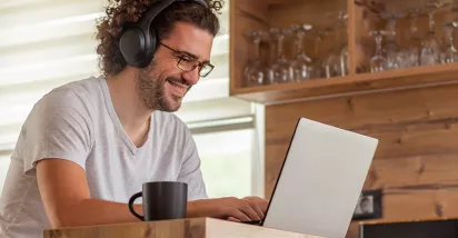 Man working at home and looking happy